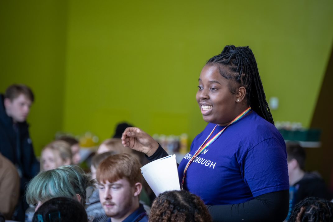 A student stood in a group speaking